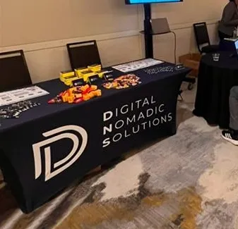 A Digital Nomadic Solutions stall at a job fair.